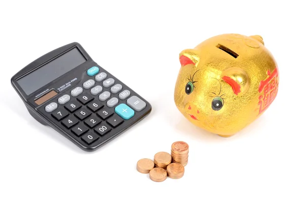 Hucha y monedas con calculadora — Foto de Stock