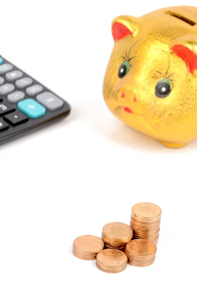 Piggy bank and coins with calculator — Stock Photo, Image