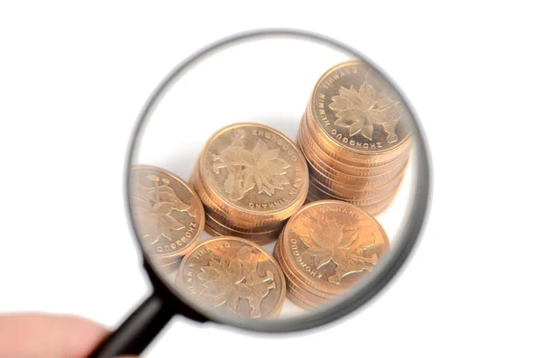 Magnifier and coin — Stock Photo, Image
