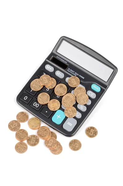 Калькулятор и монета — стоковое фото