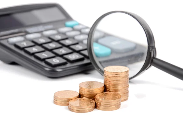 Magnifier,coins and calculator — Stock Photo, Image