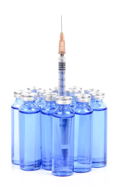 Syringe and vials on white background — Stock Photo, Image