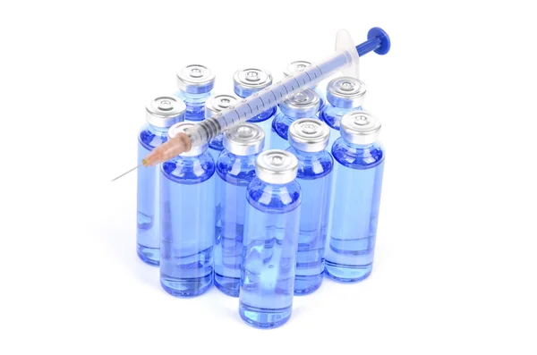 Syringe and vials on white background — Stock Photo, Image