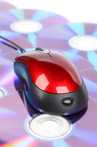 DVD and computer mouse on white background — Stock Photo, Image