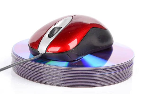 Computer mouse and DVD on white background — Stock Photo, Image