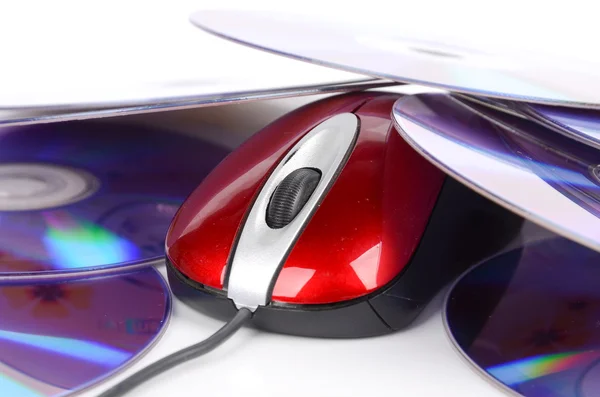 Computer mouse and DVD on white background — Stock Photo, Image