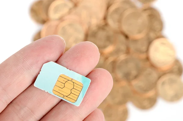 Coin and sim card — Stock Photo, Image