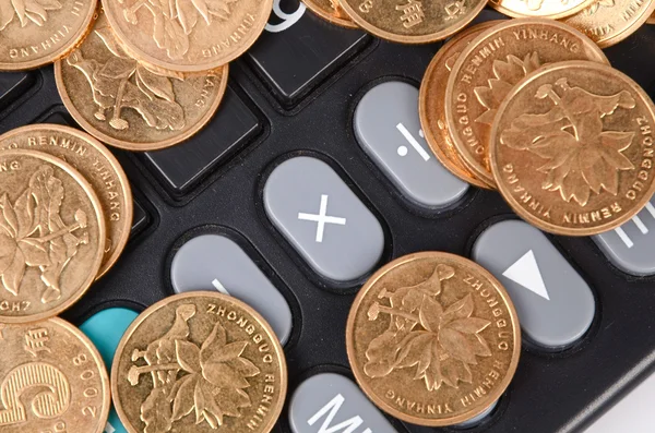 Coin and calculator — Stock Photo, Image