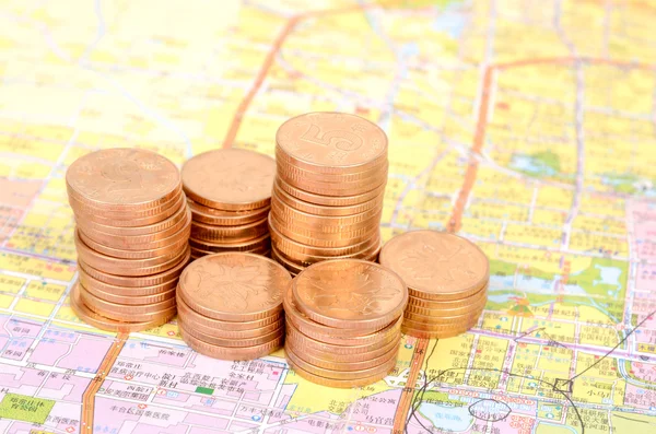 Coins and map — Stock Photo, Image