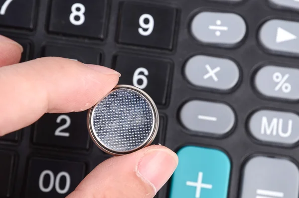 Lithium battery and calculator — Stock Photo, Image