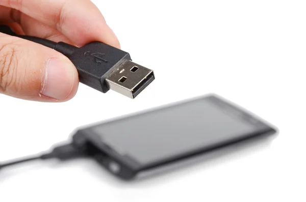 Mobilní telefon a usb na bílém pozadí — Stock fotografie