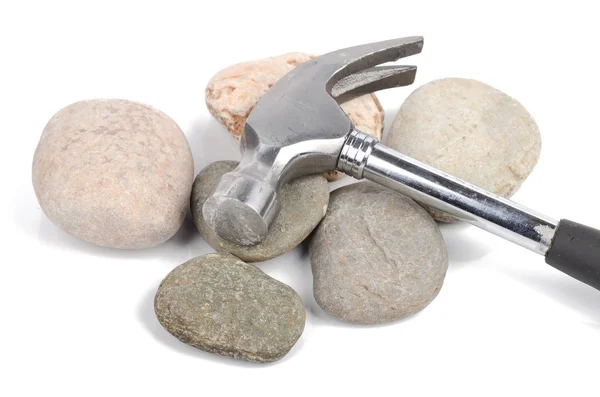 Hammer and stone on white background — Stock Photo, Image