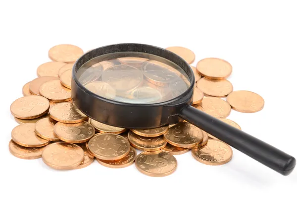 Magnifier and coin — Stock Photo, Image