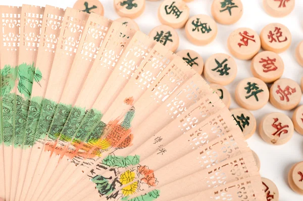 Chinese chess and hand fan Stock Image