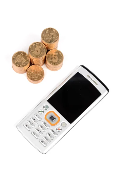 Telefon und Münze — Stockfoto