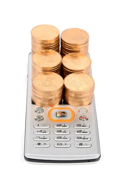 Telefone e moeda — Fotografia de Stock