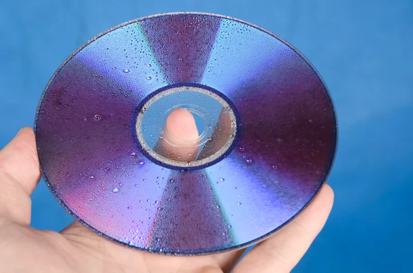 DVD sobre fundo azul — Fotografia de Stock