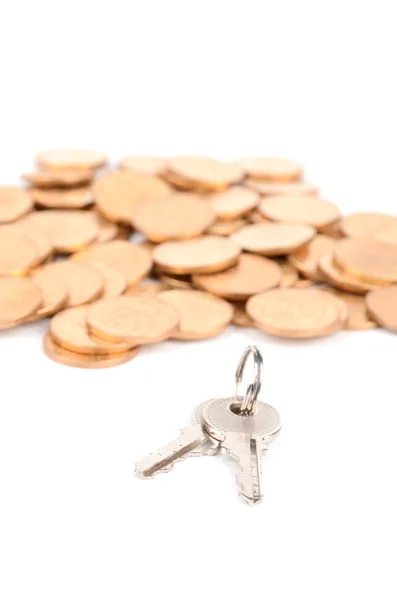 Münze und Schlüssel — Stockfoto