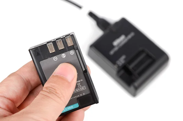 Camera battery and charger — Stock Photo, Image