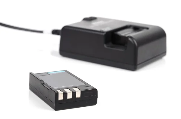 Camera battery and charger — Stock Photo, Image