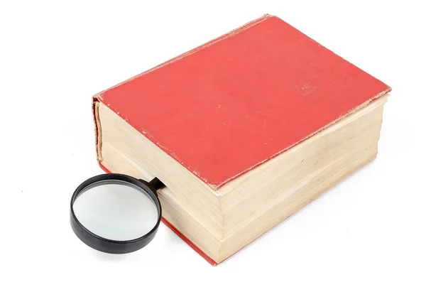 Dictionary and magnifier — Stock Photo, Image