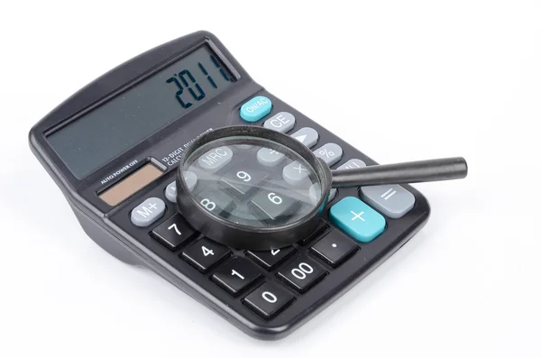 Magnifier and calculator — Stock Photo, Image