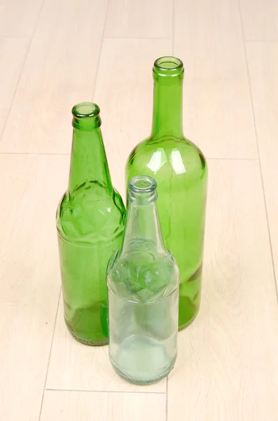 Wine bottle on floor — Stock Photo, Image