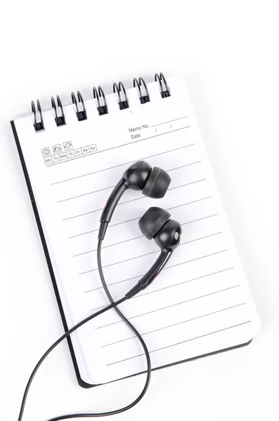 Notepad and earphone — Stock Photo, Image