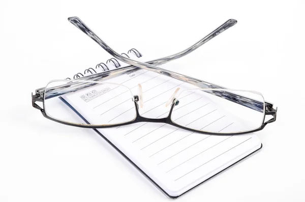 笔记本和眼镜 免版税图库照片