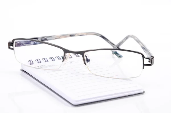 笔记本和眼镜 免版税图库照片
