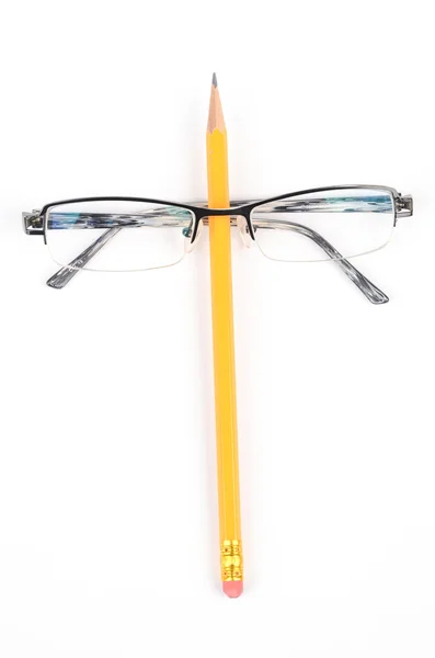 Pencil and glasses Royalty Free Stock Photos