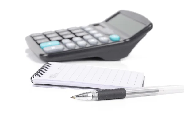 Pen and notepad with calculator — Stock Photo, Image