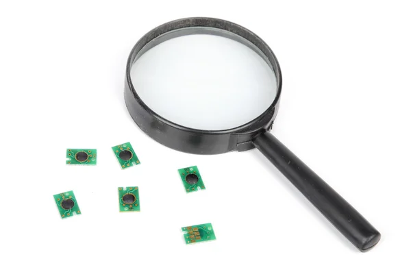 Chip and magnifier — Stock Photo, Image