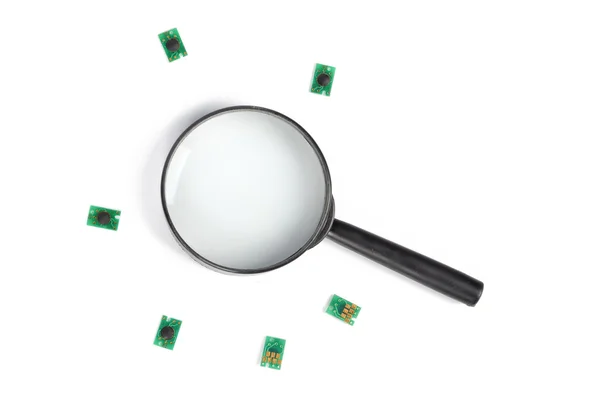 Chip and magnifier — Stock Photo, Image