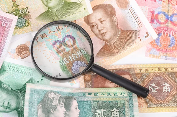 Magnifier and chinese currency — Stock Photo, Image