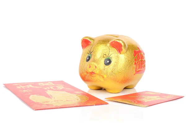 Piggy bank en rode pakje — Stockfoto