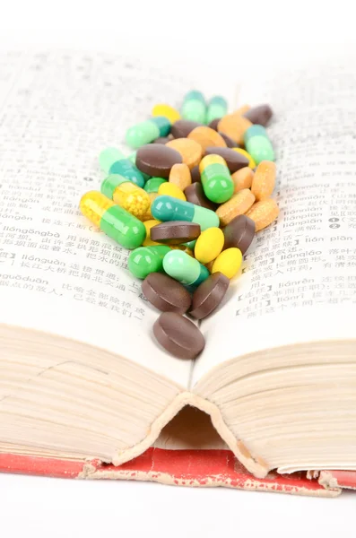 Book and medicine — Stock Photo, Image