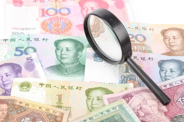 Magnifier and chinese currency — Stock Photo, Image