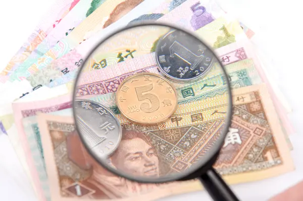 Magnifier and chinese currency — Stock Photo, Image