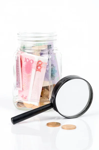 Chinese currency and magnifier — Stock Photo, Image