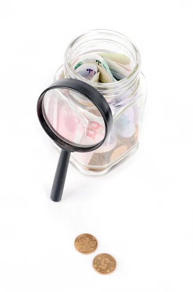Chinese currency and magnifier — Stock Photo, Image