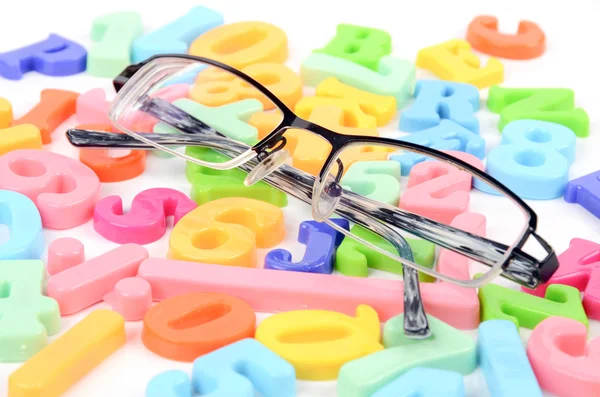 Eye glasses and letters — Stock Photo, Image