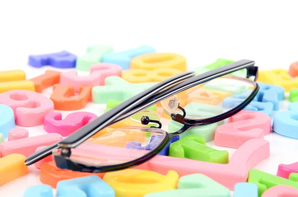 Óculos e letras oculares — Fotografia de Stock