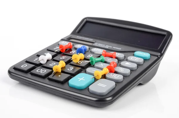 Calculator and push pin — Stock Photo, Image