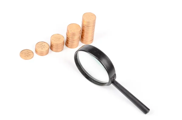 Magnifier and coins — Stock Photo, Image