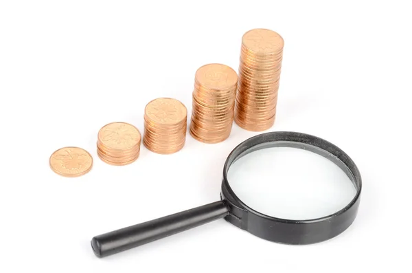 Magnifier and coins — Stock Photo, Image