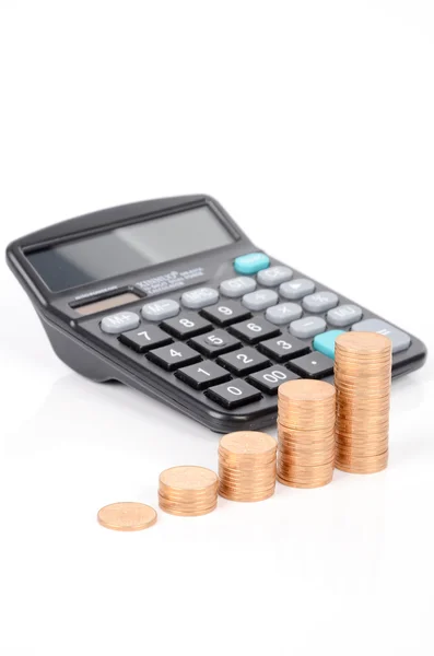 Calcolatrice e monete — Foto Stock