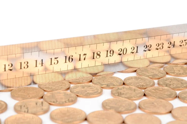 Coins and ruler — Stock Photo, Image