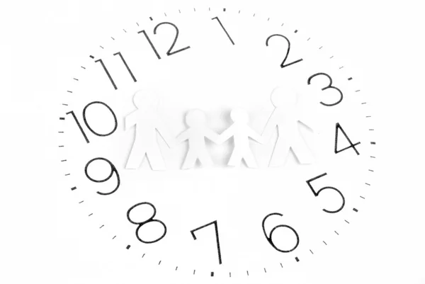 Paper man and clock face Stock Picture