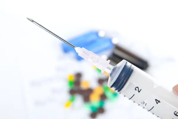 Medicine and syringe — Stock Photo, Image